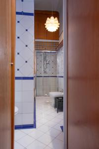a bathroom with a tub and a toilet and a sink at ArtStay Apt Sempione, Near Metro, City Centre in Milan +16 photos