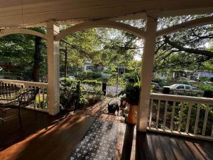 a gazebo with a dog sitting on a porch at Charming 3 bedroom Home in Decatur