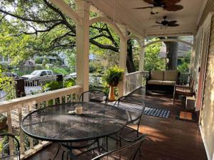 a patio with a table and chairs on a porch at Charming 3 bedroom Home in Decatur
