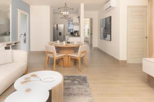 a living room with a table and a couch at Brisas del Mar by Playa Caracol Resorts in Punta Chame