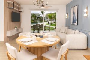 a living room with a table and a couch at Brisas del Mar by Playa Caracol Resorts in Punta Chame +42 photos