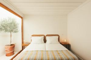 Ένα ή περισσότερα κρεβάτια σε δωμάτιο στο Pateiro da Silva Family Farmers