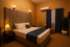 Postel nebo postele na pokoji v ubytování Veda hotel + 2 fotografie