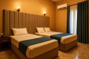 Postel nebo postele na pokoji v ubytování Veda hotel