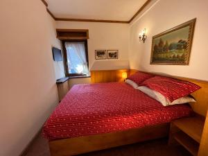 En eller flere senge i et værelse på Cortina Relax