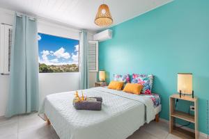 Ένα ή περισσότερα κρεβάτια σε δωμάτιο στο Résidence les 3 Mâts - Le Robert