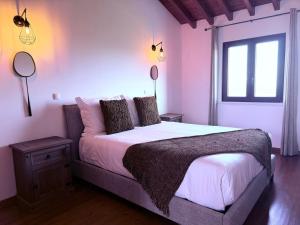 Postel nebo postele na pokoji v ubytování Azores Quinta do Segredo