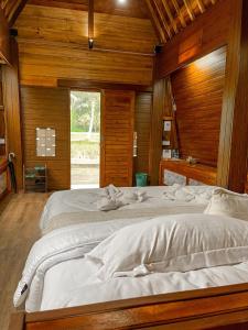 Postel nebo postele na pokoji v ubytování tarotours accommodation