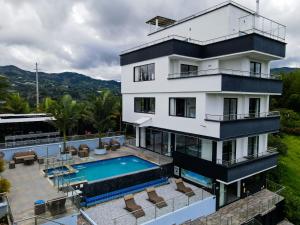 an aerial view of a house with a swimming pool at The Palms Hotel in Estación El Salto