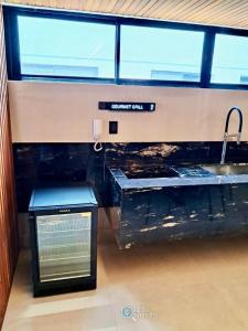 a kitchen with a sink and a counter with a sink at Hit Cabo Branco by 123Quarto in João Pessoa