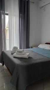 Ένα ή περισσότερα κρεβάτια σε δωμάτιο στο Vana's Apartments +7 φωτογραφίες