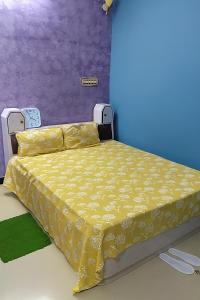 Ένα ή περισσότερα κρεβάτια σε δωμάτιο στο Veena Vihar