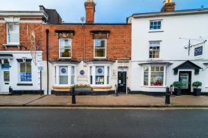 a row of buildings on a city street at Enigma Lodge in Stratford-upon-Avon