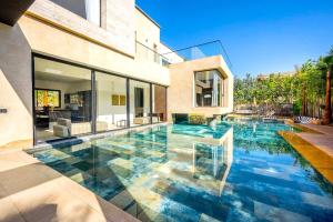 a swimming pool in the middle of a house at Palais Zahira in Marrakesh