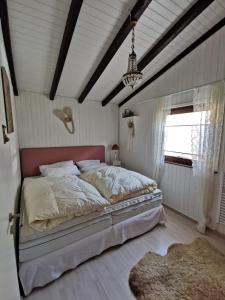 En eller flere senge i et værelse på Ferienhaus Bärenloch