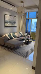 a living room with a couch and a table at Apartment suite in Manama