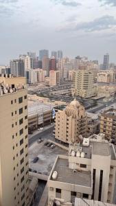 an aerial view of a city with tall buildings at Apartment suite in Manama