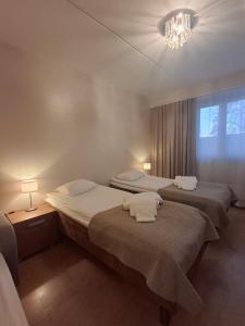 Giường trong phòng chung tại Backbyn Kartano +43 ảnh