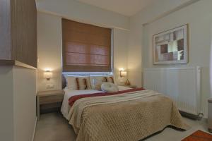 Ένα ή περισσότερα κρεβάτια σε δωμάτιο στο SIGMA - Signature Living by Optimum Link