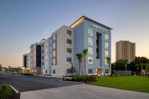 a rendering of an apartment building in a city at TownePlace Suites by Marriott Miramar Beach Destin in Destin
