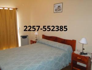 En eller flere senge i et værelse på Duplex Quimey