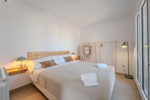 En eller flere senge i et værelse på Casa Carmen Girona