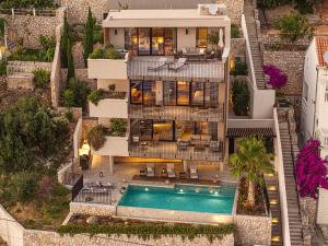 an aerial view of a house with a swimming pool at Villa Eleven Excelsior in Dubrovnik