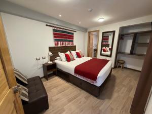 Giường trong phòng chung tại CASA CRISTOBAL Centenario