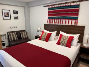 Giường trong phòng chung tại CASA CRISTOBAL Centenario