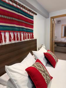 Giường trong phòng chung tại CASA CRISTOBAL Centenario