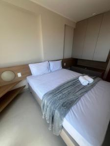 Ένα ή περισσότερα κρεβάτια σε δωμάτιο στο Studio Design 3 Apt 809 -Mandi Hospitalidade