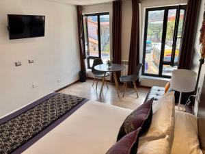 Giường trong phòng chung tại CASA CRISTOBAL Centenario