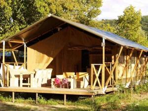 a large tent with a table and chairs in it at Camping 3 étoiles - Piscine - ccbccbe in Sartène