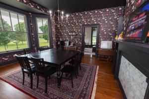 a dining room with a table and chairs at Old Furnace Inn in Harrisonburg