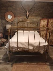 En eller flere senge i et værelse på La Botica del Lobo