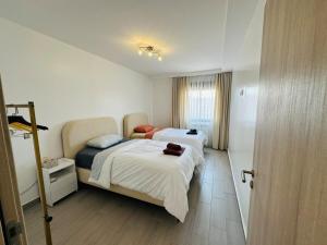 En eller flere senge i et værelse på Joli f3 a Gambetta - king bed - fast internet - 100m2 + 28 billeder