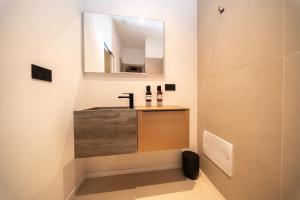 Et badeværelse på Donna Isabella - Boutique Rooms