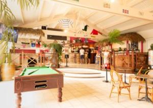 a store with a pool table in the middle of a room at Mobile Homes by KelAir at Camping La Yole in Saint-Jean-de-Monts