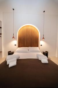 En eller flere senge i et værelse på Donna Isabella - Boutique Rooms