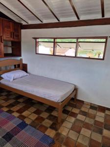 Ένα ή περισσότερα κρεβάτια σε δωμάτιο στο Casa do cabore