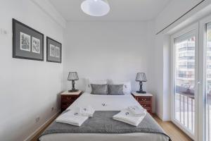 En eller flere senge i et værelse på Lovely Sá - By Y Concept