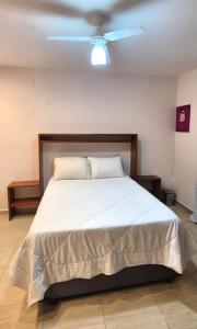 Postel nebo postele na pokoji v ubytování Aconchego III