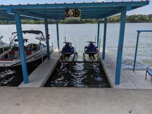 two boats are docked at a dock on the water at Valentine Lakeside in Kingsland