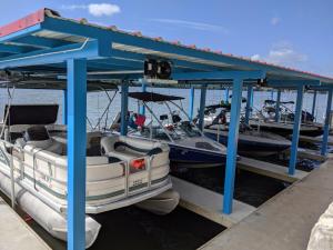 a couple of boats are docked at a dock at Valentine Lakeside in Kingsland