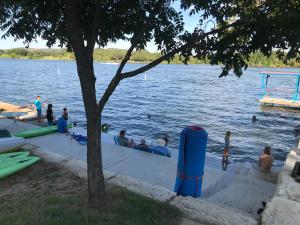 a group of people swimming in the water at Valentine Lakeside in Kingsland