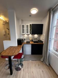 Kuchyň nebo kuchyňský kout v ubytování Appartement Le Signature