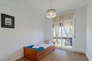 En eller flere senge i et værelse på Lovely Urbisado III - By Y Concept