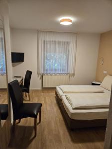 Postel nebo postele na pokoji v ubytování Hotel - Restaurant Baumann + 50 fotografií