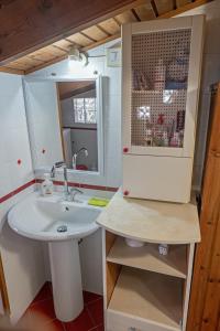 a bathroom with a sink and a mirror at Casa di Rosy in San Sperate +33 photos