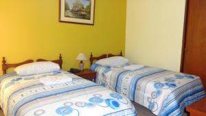 Postel nebo postele na pokoji v ubytování Hotel Las Lineas